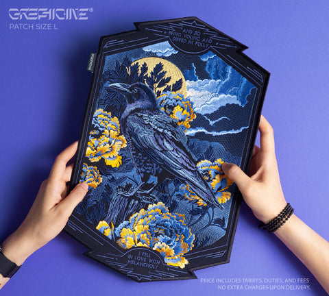 A person holds the Crow and Peonies Embroidered Back Patch, featuring a black crow among yellow flowers, blue foliage, gothic-style text, and a moonlit cloud background in detailed embroidery.