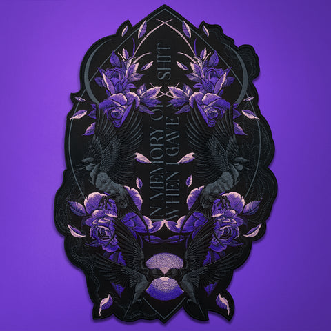 The Swallows And Flowers Custom Embroidered Patch features purple roses, dark birds, and the text "IN MEMORY OF ALL THE SHIT I GAVE" on black—an eye-catching, bold gift set against a solid purple background.