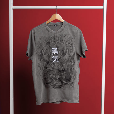 The Cyberpunk Oni Embroidered Unisex T-shirt, featuring a horned demon and Japanese kanji inspired by Japanese mythology, hangs on a wooden hanger against a bold red background.