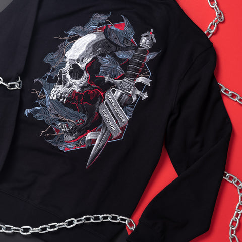 The Skull & Dagger Unisex Embroidered Hoodie is a black gothic streetwear piece with a skull, blue leaves, and a large dagger reading Choppershoppe Division, adding a bold metal edge to your style.