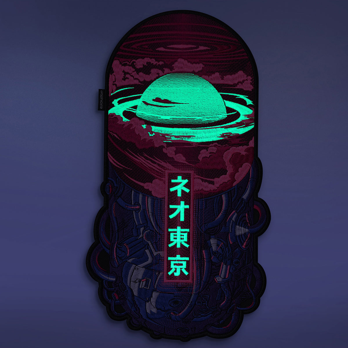 The Neo Tokyo Pill Embroidered Back Patch features a glowing green planet above swirling clouds, Japanese characters below, and a cyberpunk vibe on a dark purple background.