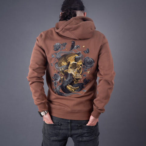 A person models gothic streetwear in the Skull and Snake Skeleton Unisex Embroidered Hoodie, featuring a gold skull with a black snake and roses on the back. Posed against a plain gray background with their face turned away.